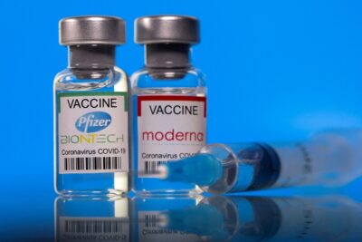 file photo: picture illustration of vials with pfizer biontech and moderna coronavirus disease (covid 19) vaccine labels