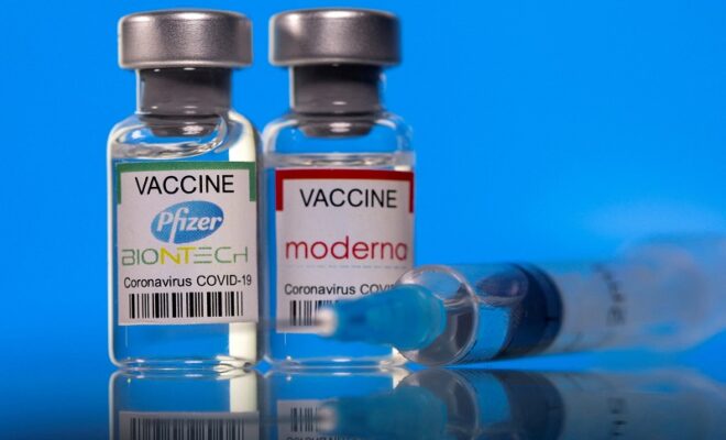 file photo: picture illustration of vials with pfizer biontech and moderna coronavirus disease (covid 19) vaccine labels