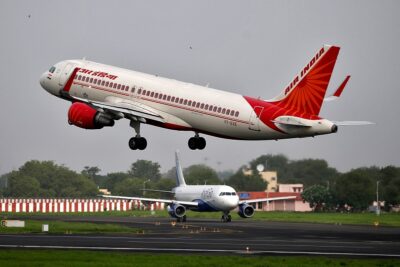 file photo: an air india airbus a320 aircraft takes off as an indigo airlines aircraft waits for clearance at the sardar vallabhbhai patel international airport in ahmedabad