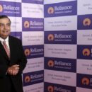 mukesh ambani, chairman of reliance industries limited, poses for photographers before addressing the annual shareholders meeting in mumbai