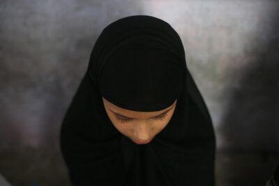 a muslim girl learns to read the koran at a madrassa during ramadan in old quarters of delhi