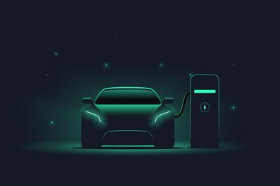 electric,car,at,charging,station.,front,view,electric,car,silhouette