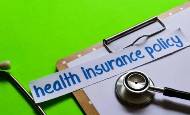 health insurance policy on healthcare concept with green background