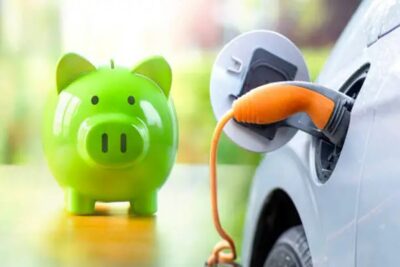 green piggy bank while charging electric vehicle