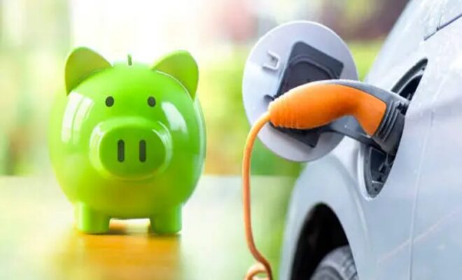 green piggy bank while charging electric vehicle